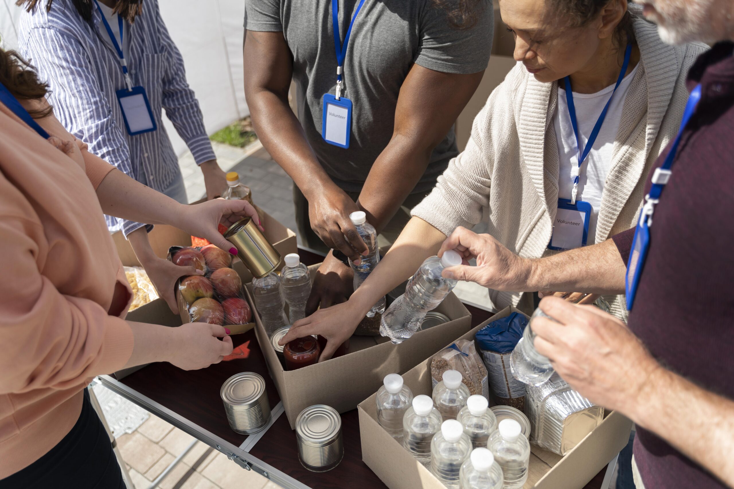 group different people volunteering foodbank poor people